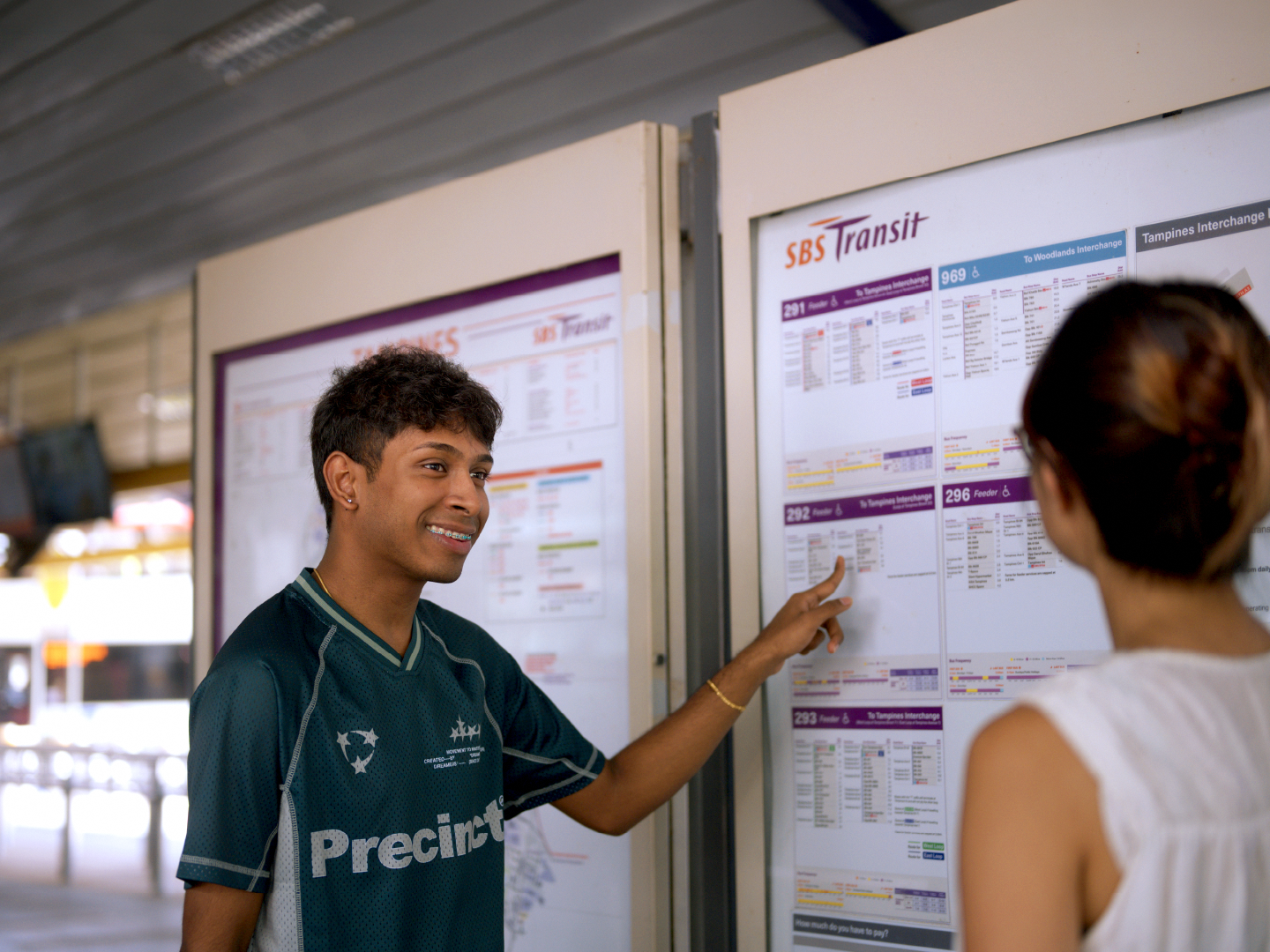 Vishakan was giving directions to a commuter at the bus information board. Source: Public Transport Council